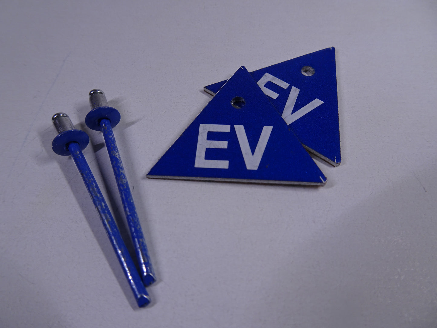 EV Triangle with colour matched rivet